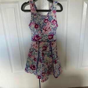 Sweet Honey tennis romper. Purple and pink floral